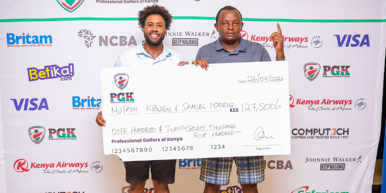 Mutahi Kibugu and Simon Njoroge pose for a photo while holding their cheque.